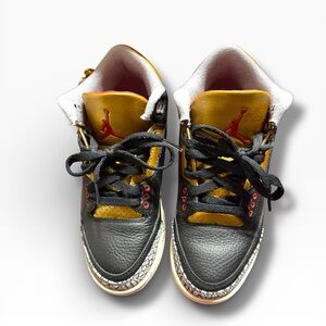 Jordan  Black and Gold Sneakers